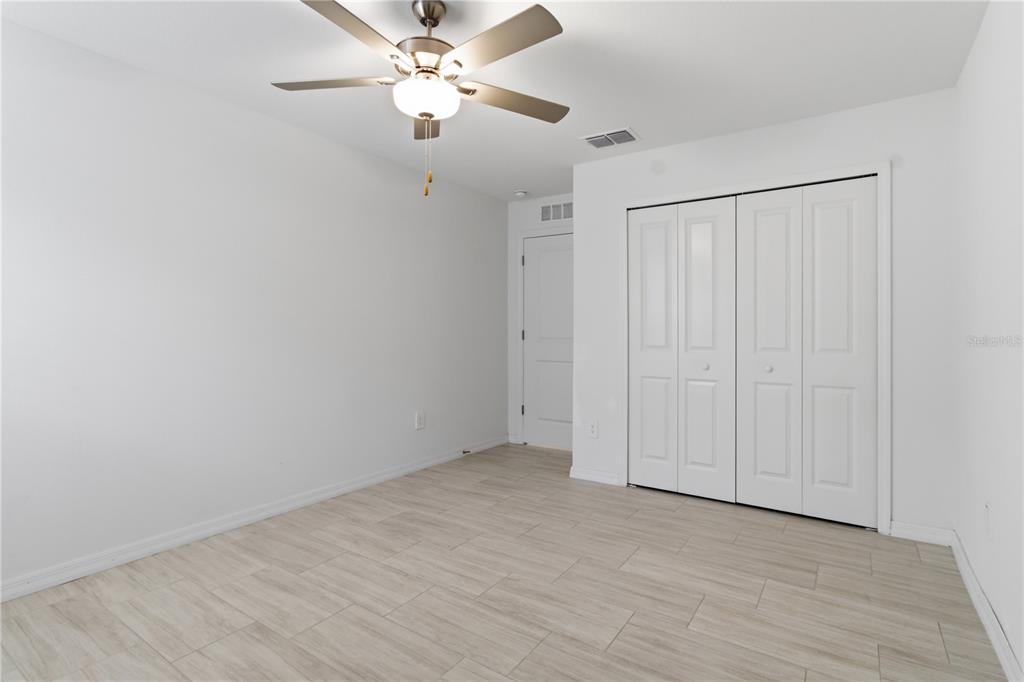 2455 Lanier Road Zephyrhills, FL 33541 - Photo 33 of 39 wooden floor in an empty room
