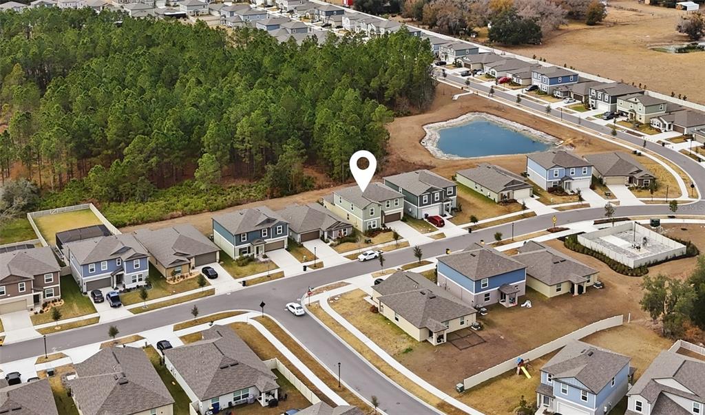 2455 Lanier Road Zephyrhills, FL 33541 - Photo 36 of 39 an aerial view of a house with outdoor space