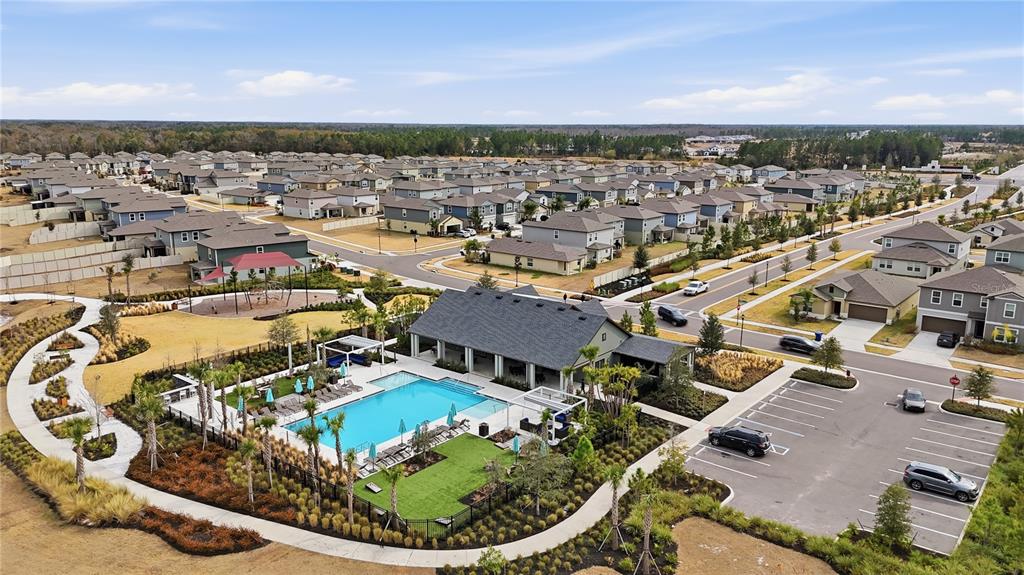 2455 Lanier Road Zephyrhills, FL 33541 - Photo 39 of 39 an aerial view of a house with a mountain
