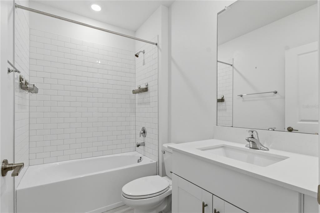 2455 Lanier Road Zephyrhills, FL 33541 - Photo 8 of 39 a bathroom with a sink toilet and shower