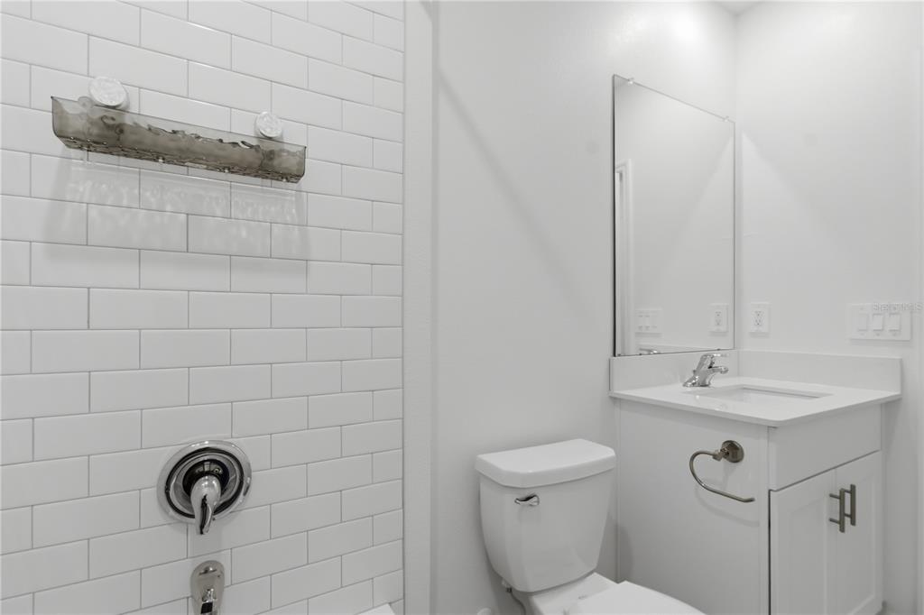 2455 Lanier Road Zephyrhills, FL 33541 - Photo 9 of 39 a bathroom with a toilet sink and mirror