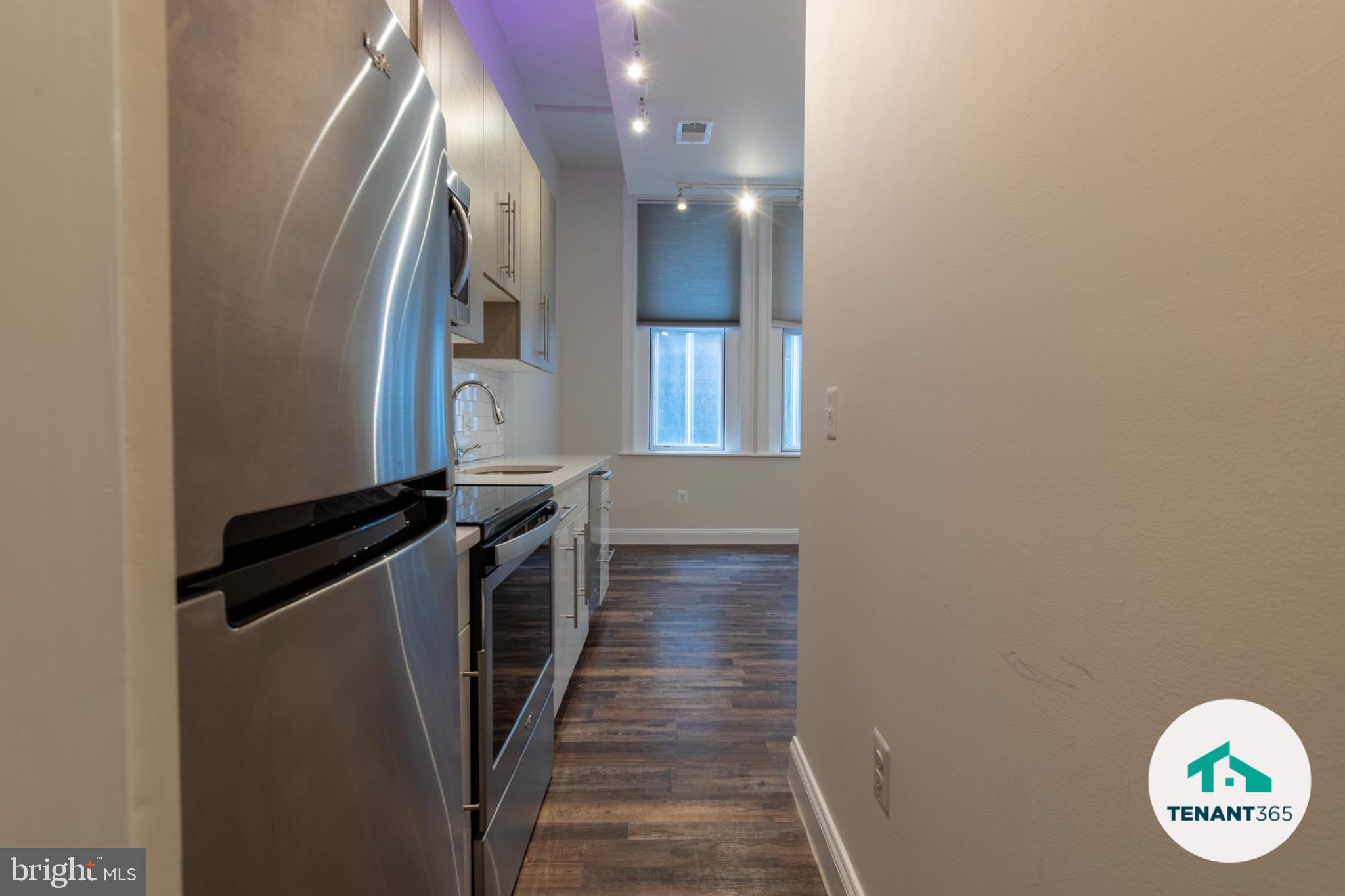 8 East Fayette Street, Unit 201 Baltimore, MD 21202 - Photo 3 of 14 Modern kitchen with sleek finishes.