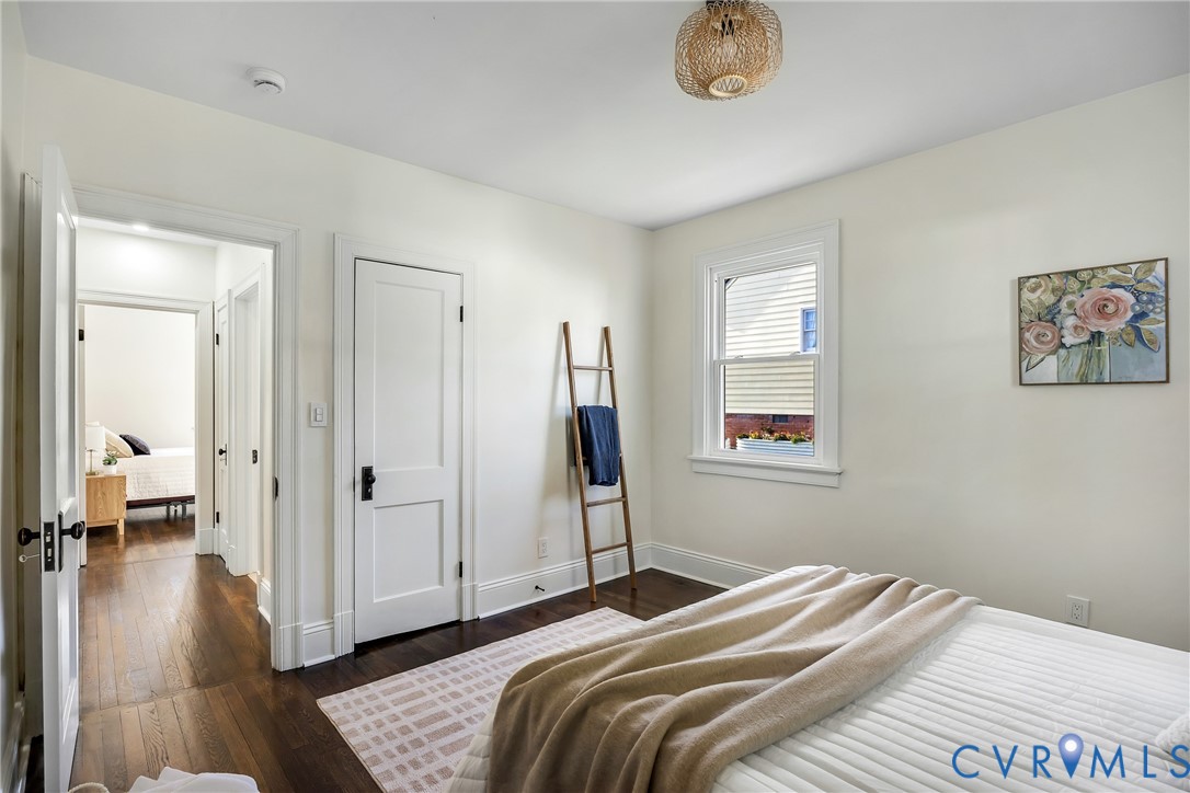 7232 Edgeworth Road Mechanicsville, VA 23111 - Photo 15 of 31 Bedroom with dark wood finished floors and baseboa
