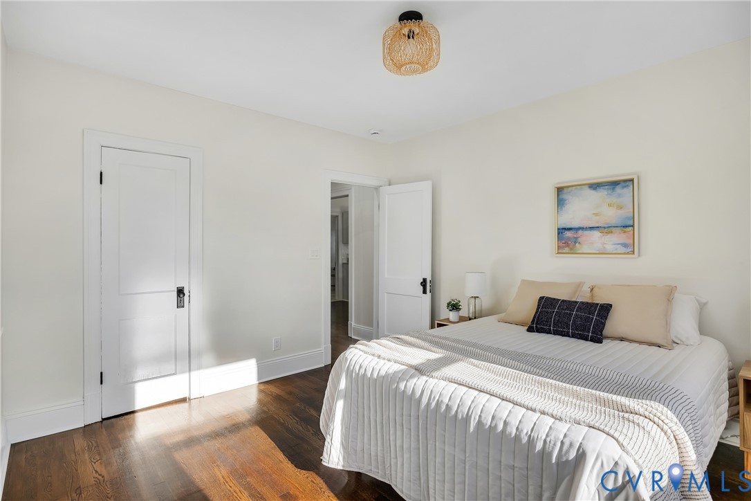 7232 Edgeworth Road Mechanicsville, VA 23111 - Photo 17 of 31 Bedroom featuring dark wood-style flooring and bas