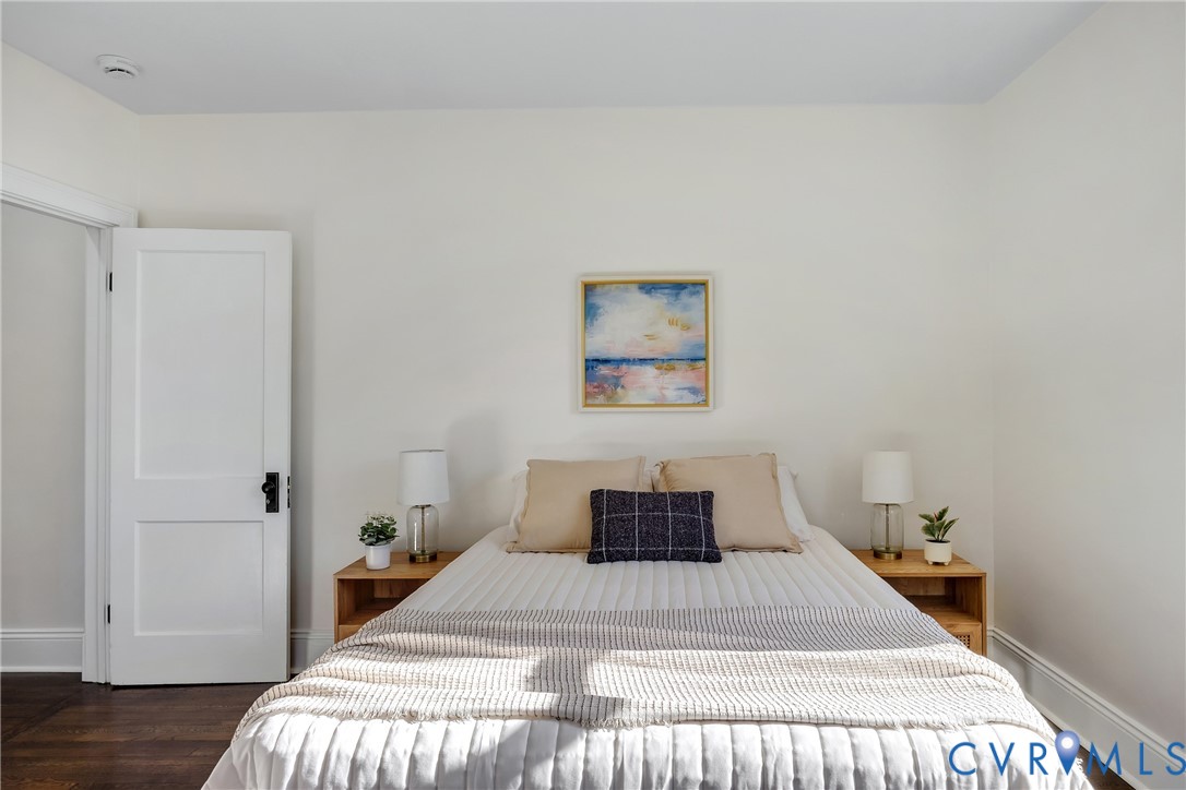 7232 Edgeworth Road Mechanicsville, VA 23111 - Photo 18 of 31 Bedroom featuring baseboards and dark wood finishe
