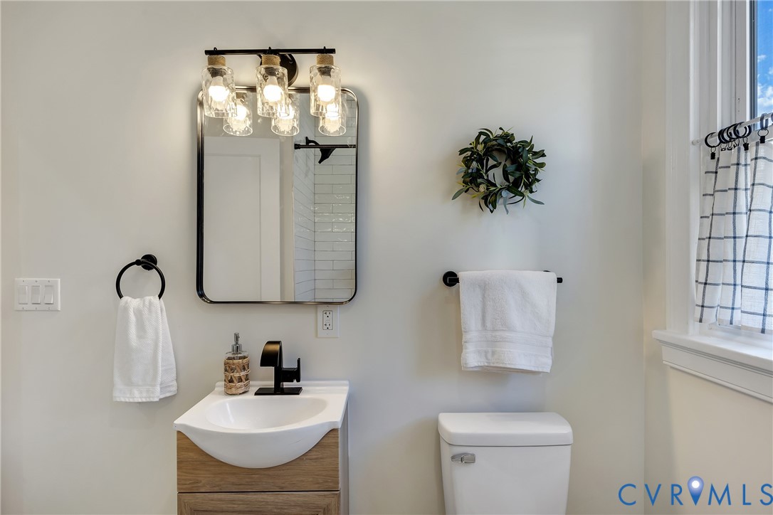 7232 Edgeworth Road Mechanicsville, VA 23111 - Photo 19 of 31 Bathroom featuring vanity and toilet