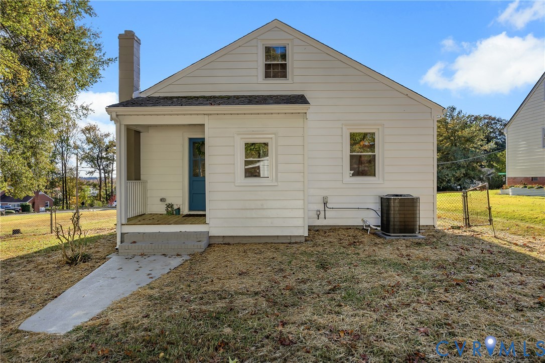 7232 Edgeworth Road Mechanicsville, VA 23111 - Photo 28 of 31 Rear view of house with a yard, a chimney, and a p