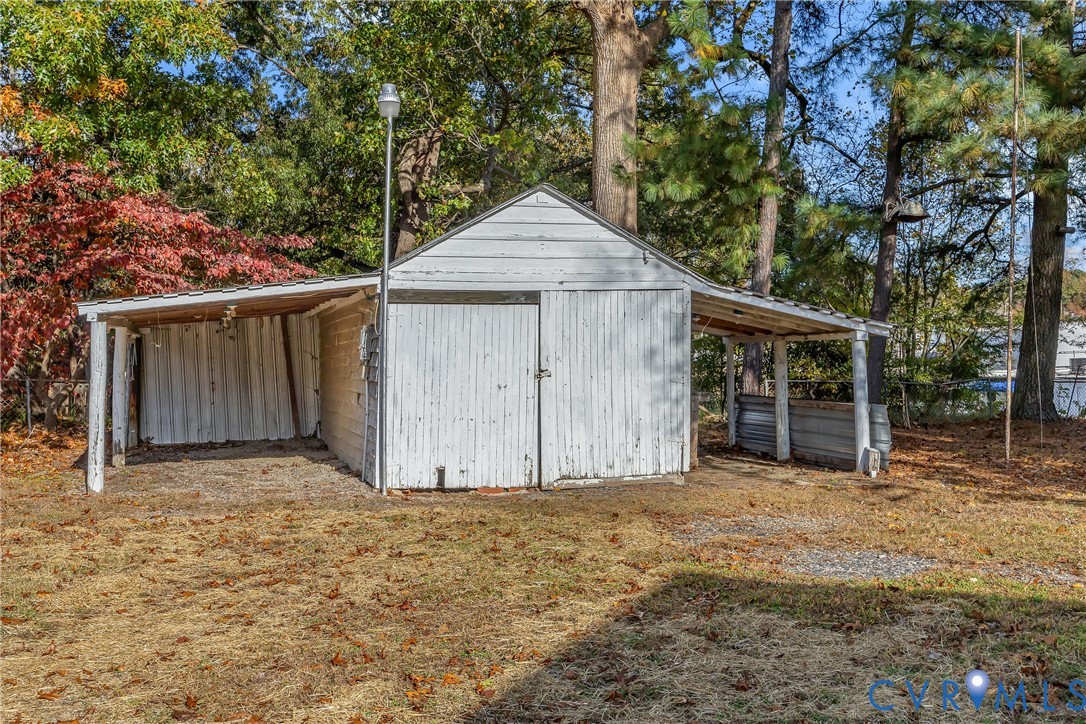 7232 Edgeworth Road Mechanicsville, VA 23111 - Photo 30 of 31 View of outbuilding featuring view of scattered tr