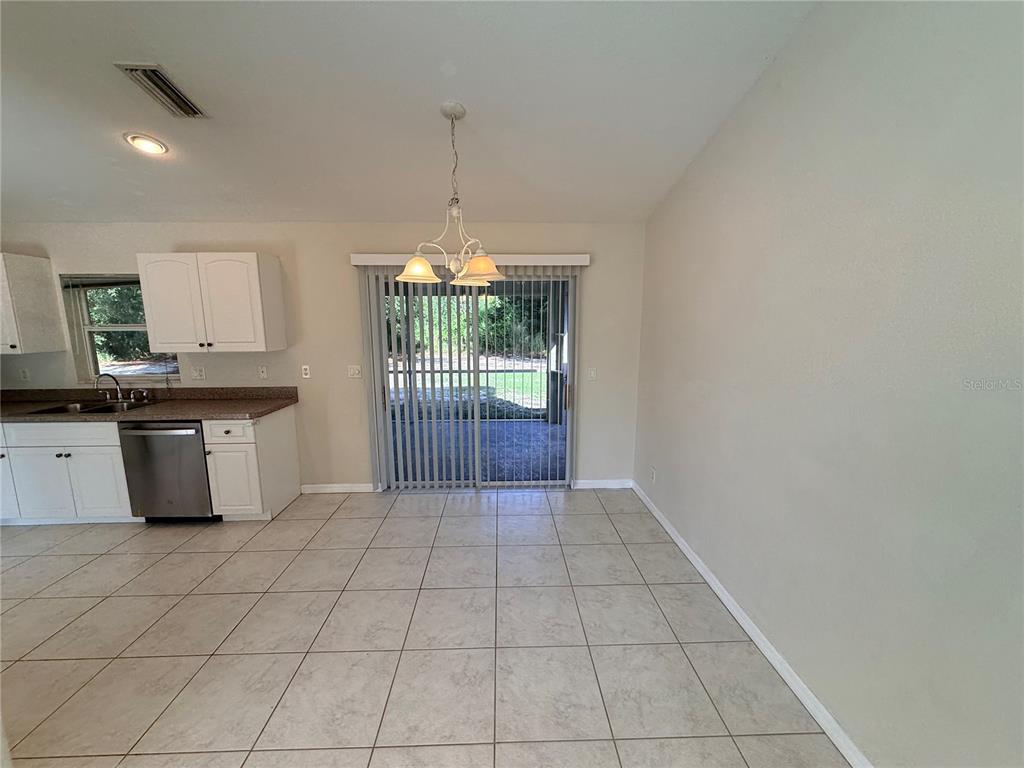 4185 Amari Road North Port, FL 34291 - Photo 5 of 14 a view of kitchen with granite countertop cabinets a sink and appliances
