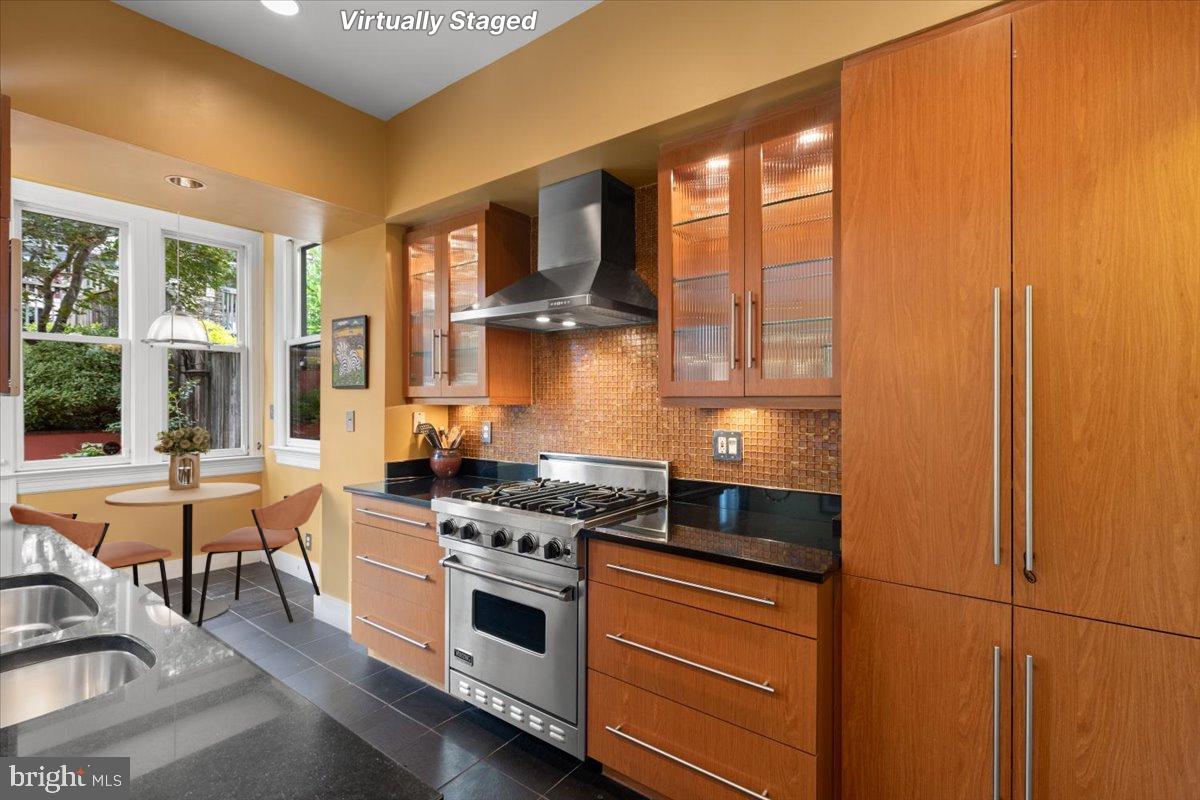 2816 27th Street Northwest Washington, DC 20008 - Photo 14 of 71 a kitchen with stainless steel appliances granite countertop a stove and a refrigerator