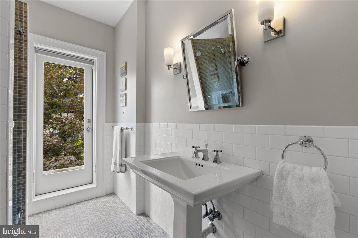 2816 27th Street Northwest Washington, DC 20008 - Photo 21 of 71 a bathroom with a sink and a mirror