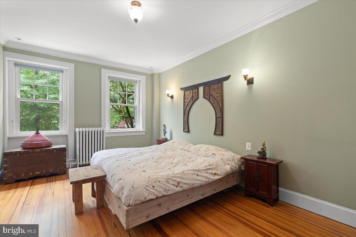 2816 27th Street Northwest Washington, DC 20008 - Photo 25 of 71 a bedroom with a bed and wooden floor