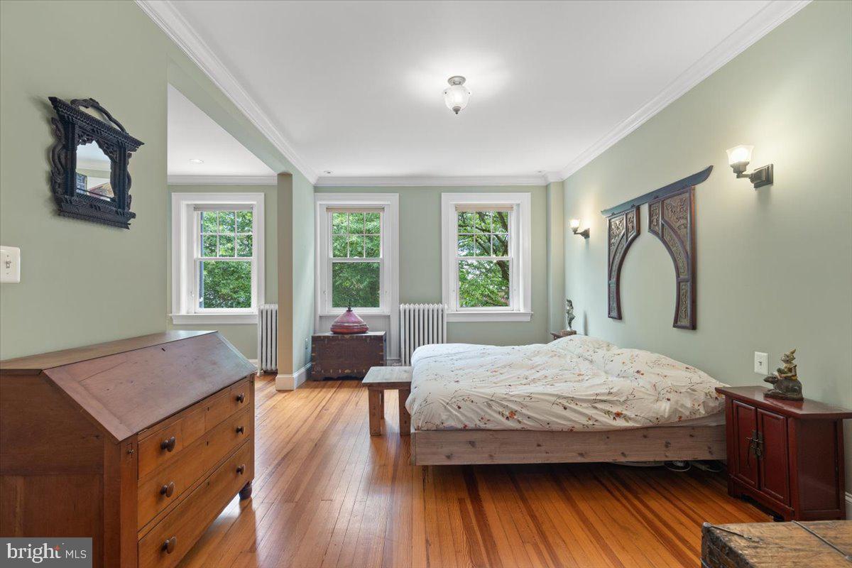 2816 27th Street Northwest Washington, DC 20008 - Photo 26 of 71 a bedroom with a bed and wooden floor