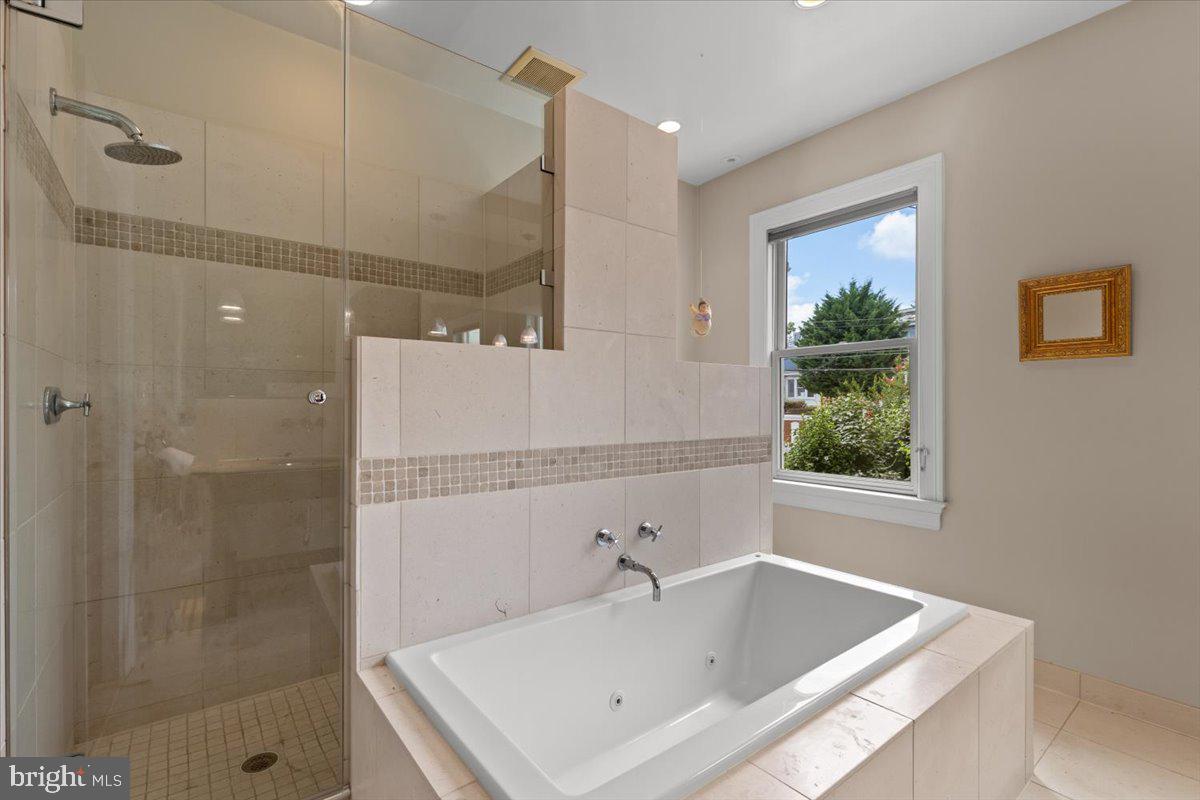 2816 27th Street Northwest Washington, DC 20008 - Photo 35 of 71 a bathroom with a tub sink and shower