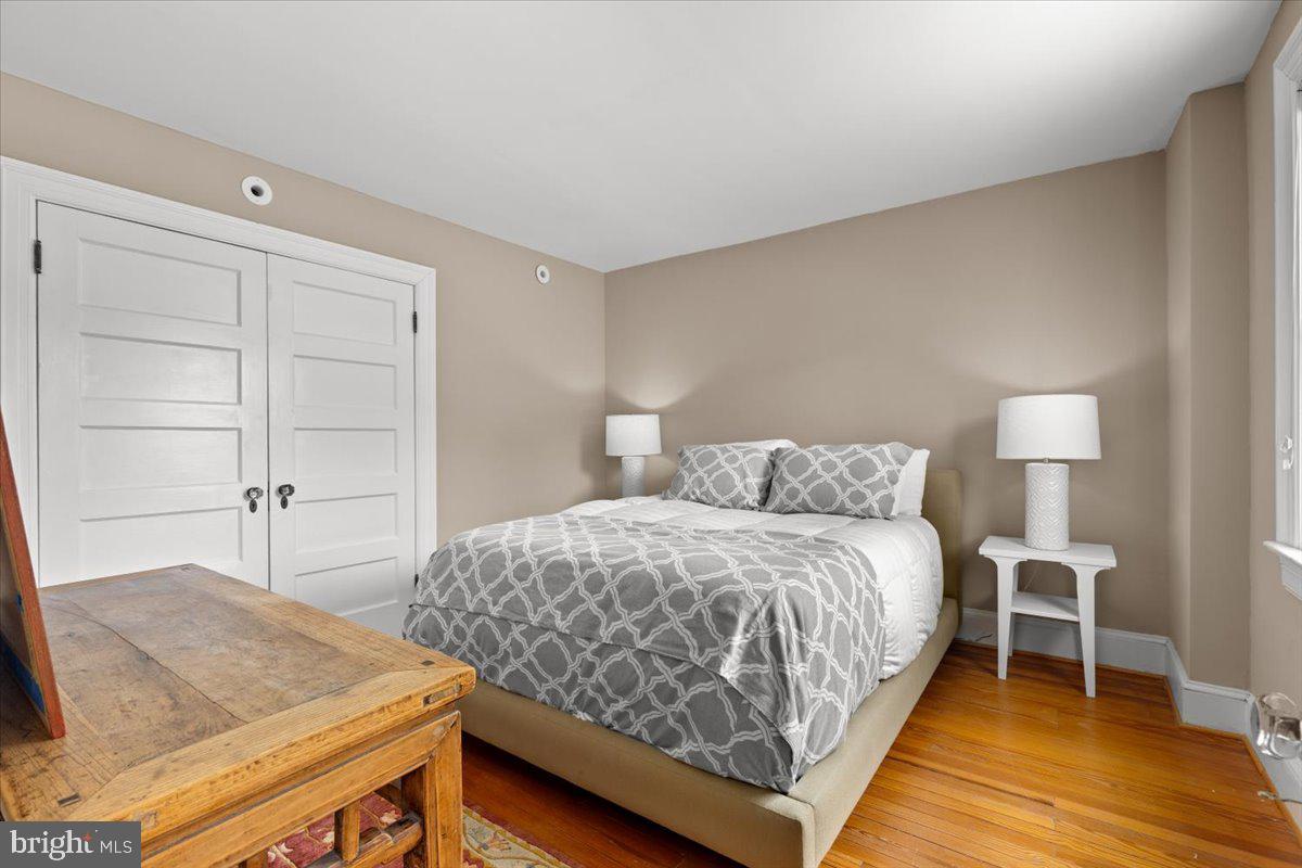 2816 27th Street Northwest Washington, DC 20008 - Photo 40 of 71 a bedroom with a bed and a night stand