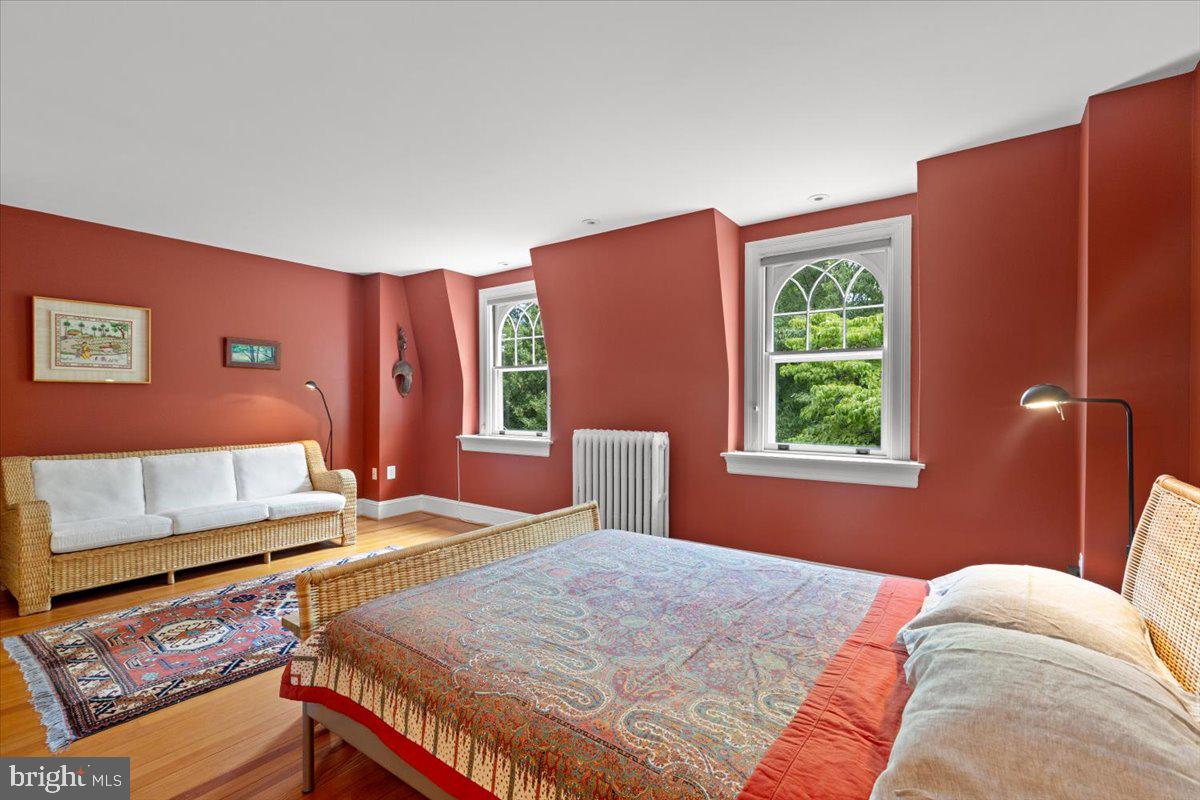 2816 27th Street Northwest Washington, DC 20008 - Photo 43 of 71 a bed sitting in a bedroom next to a window