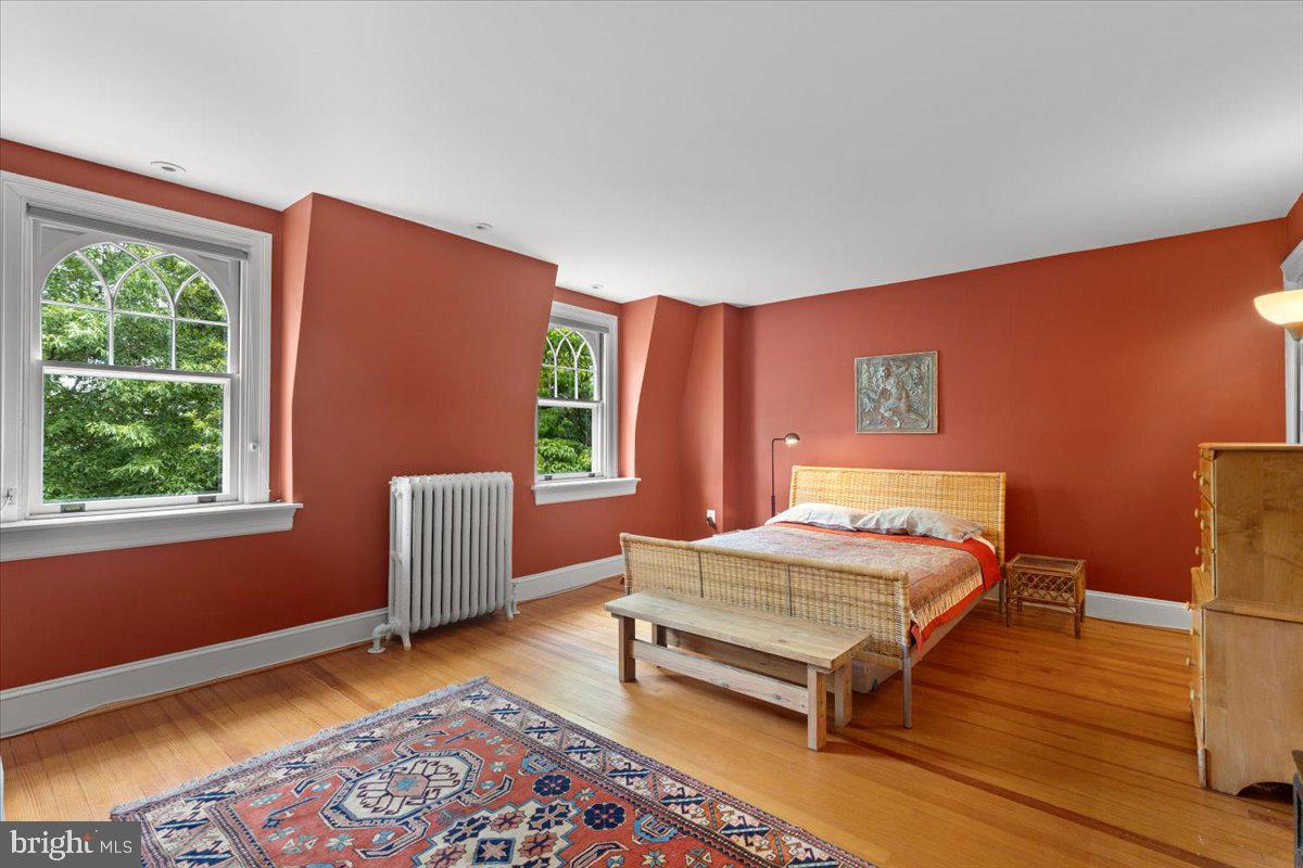 2816 27th Street Northwest Washington, DC 20008 - Photo 44 of 71 a bedroom with a bed and a window