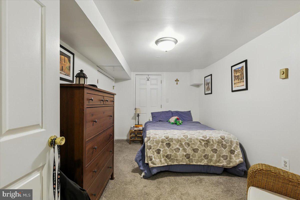 2816 27th Street Northwest Washington, DC 20008 - Photo 63 of 71 a bedroom with a bed and a dresser