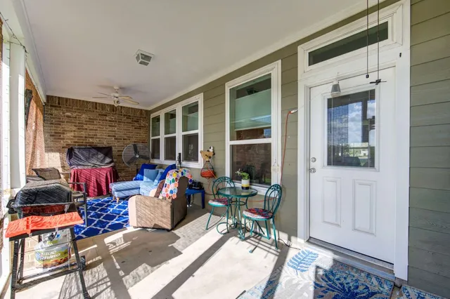 a living room filled with furniture and a window