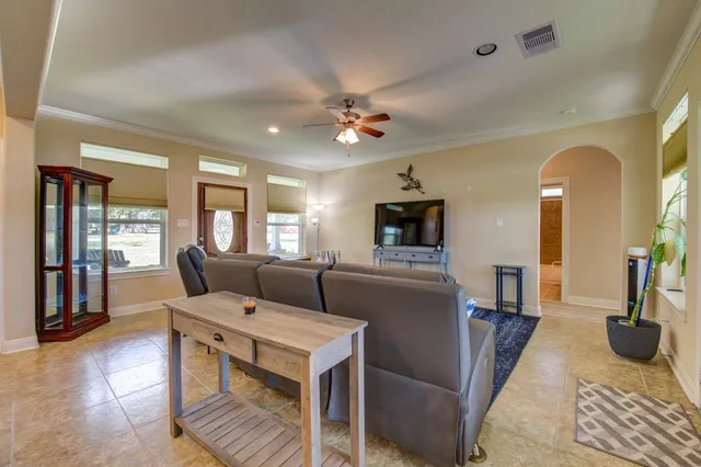 a living room with furniture and a window