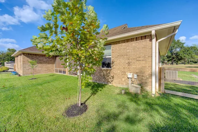 a backyard of a house with lots of green space