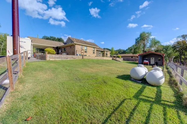 a view of a garden with lawn chairs