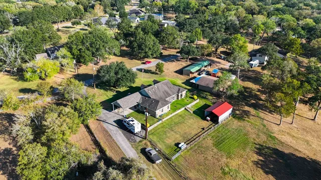 an aerial view of residential houses with outdoor space