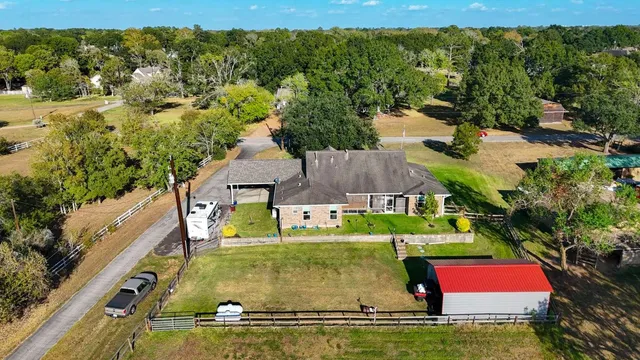 an aerial view of residential houses with outdoor space