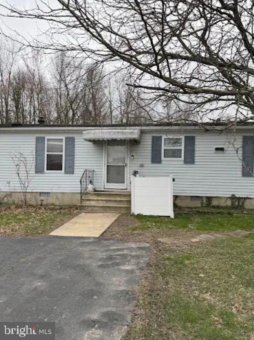 a view of a house with pool and a yard