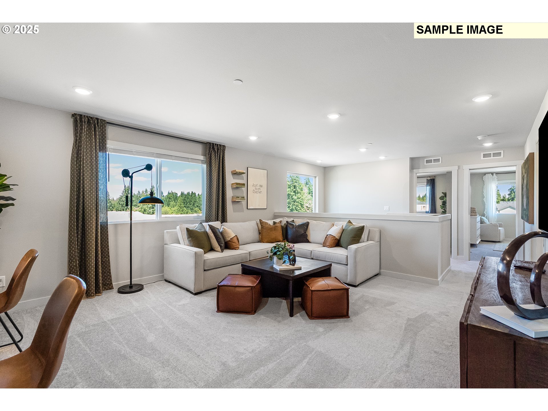2650 South 4th Way Ridgefield, WA 98642 - Photo 16 of 43 a living room with furniture a large window and a chandelier