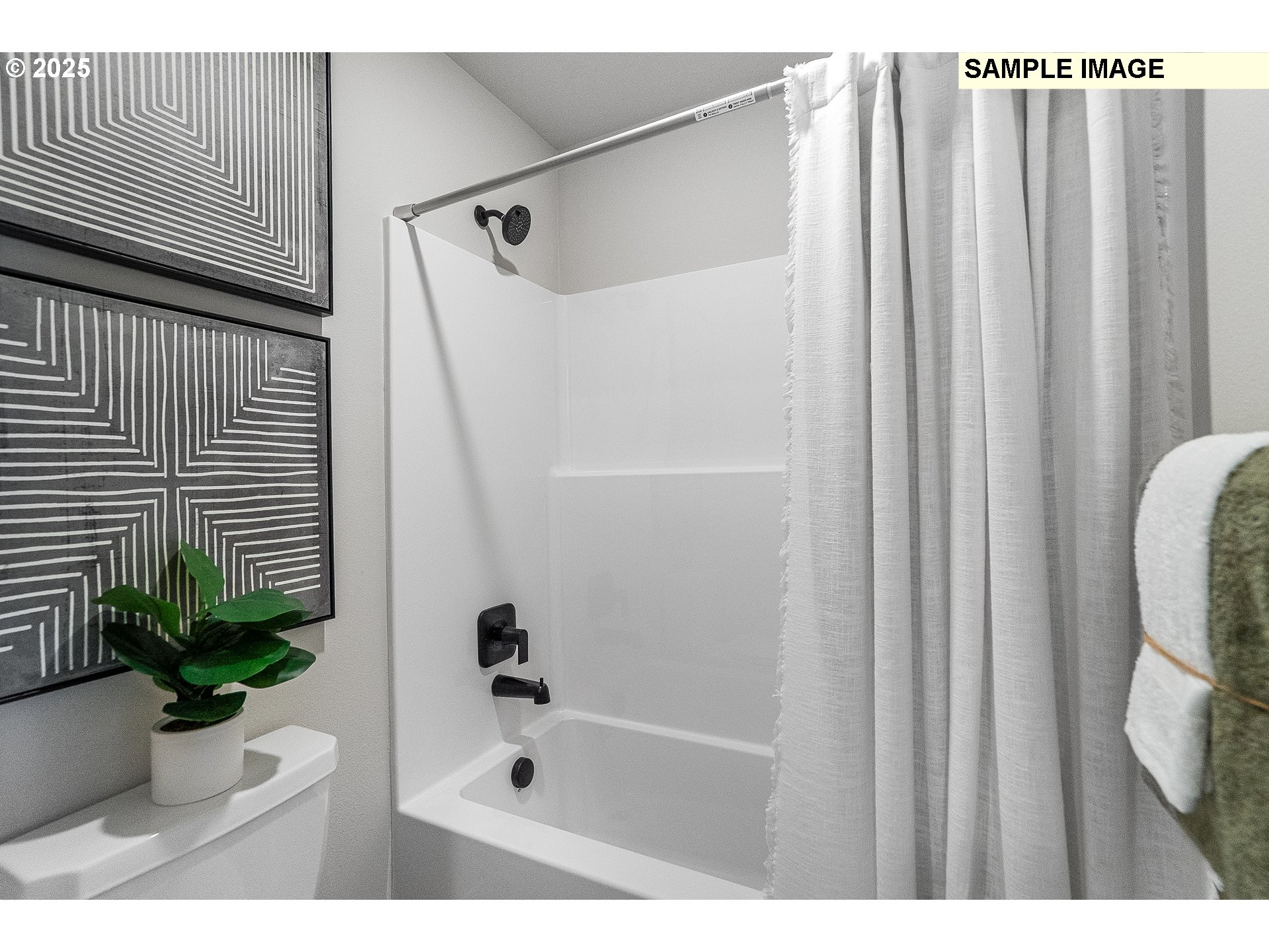 2650 South 4th Way Ridgefield, WA 98642 - Photo 19 of 43 a bathroom with a shower curtain and a window