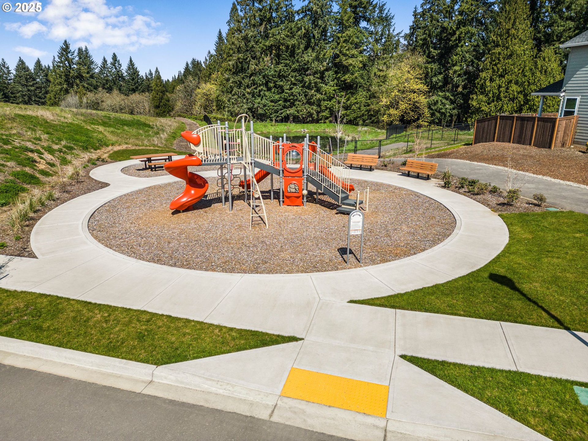 2650 South 4th Way Ridgefield, WA 98642 - Photo 33 of 43 a view of a swimming pool with a patio and wooden fence