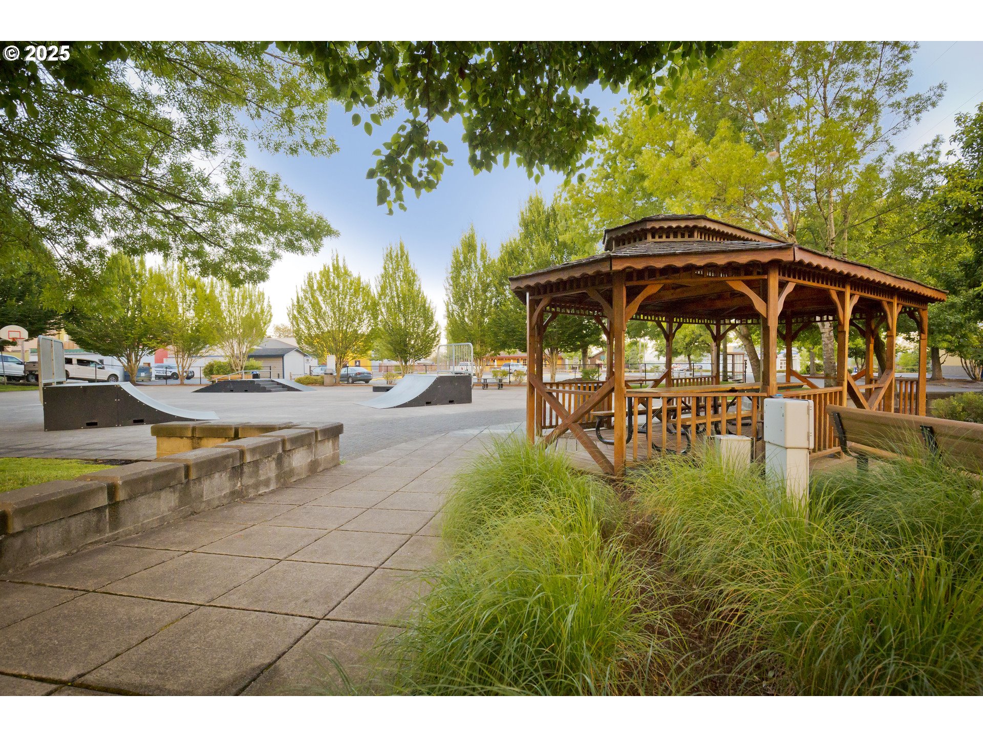 2650 South 4th Way Ridgefield, WA 98642 - Photo 39 of 43 a view of swimming pool with lawn chairs under an umbrella