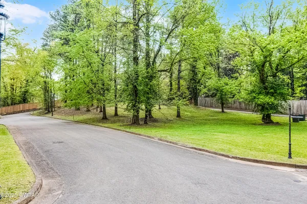 a view of an house with backyard and swimming pool