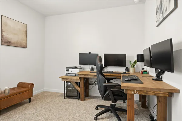 a view of a workspace with furniture