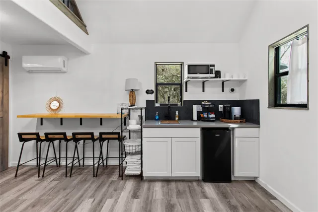 a kitchen with stainless steel appliances granite countertop a stove and cabinets