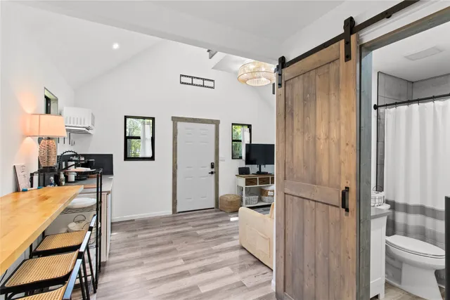a view of a livingroom with furniture and front door
