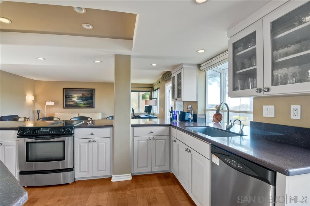 3622 Garner Place Encinitas, CA 92024 - Photo 13 of 25 a kitchen with a sink stove and cabinets