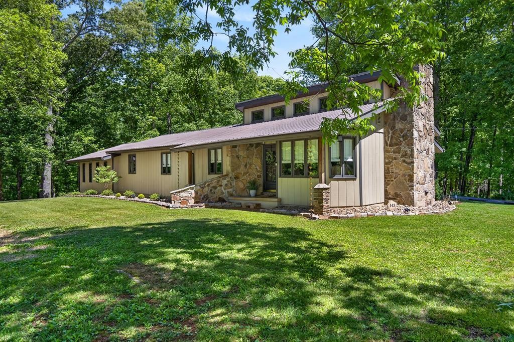 143 Griffintown Road Sparta, TN 38583 - Photo 1 of 35 a view of a house with backyard and garden