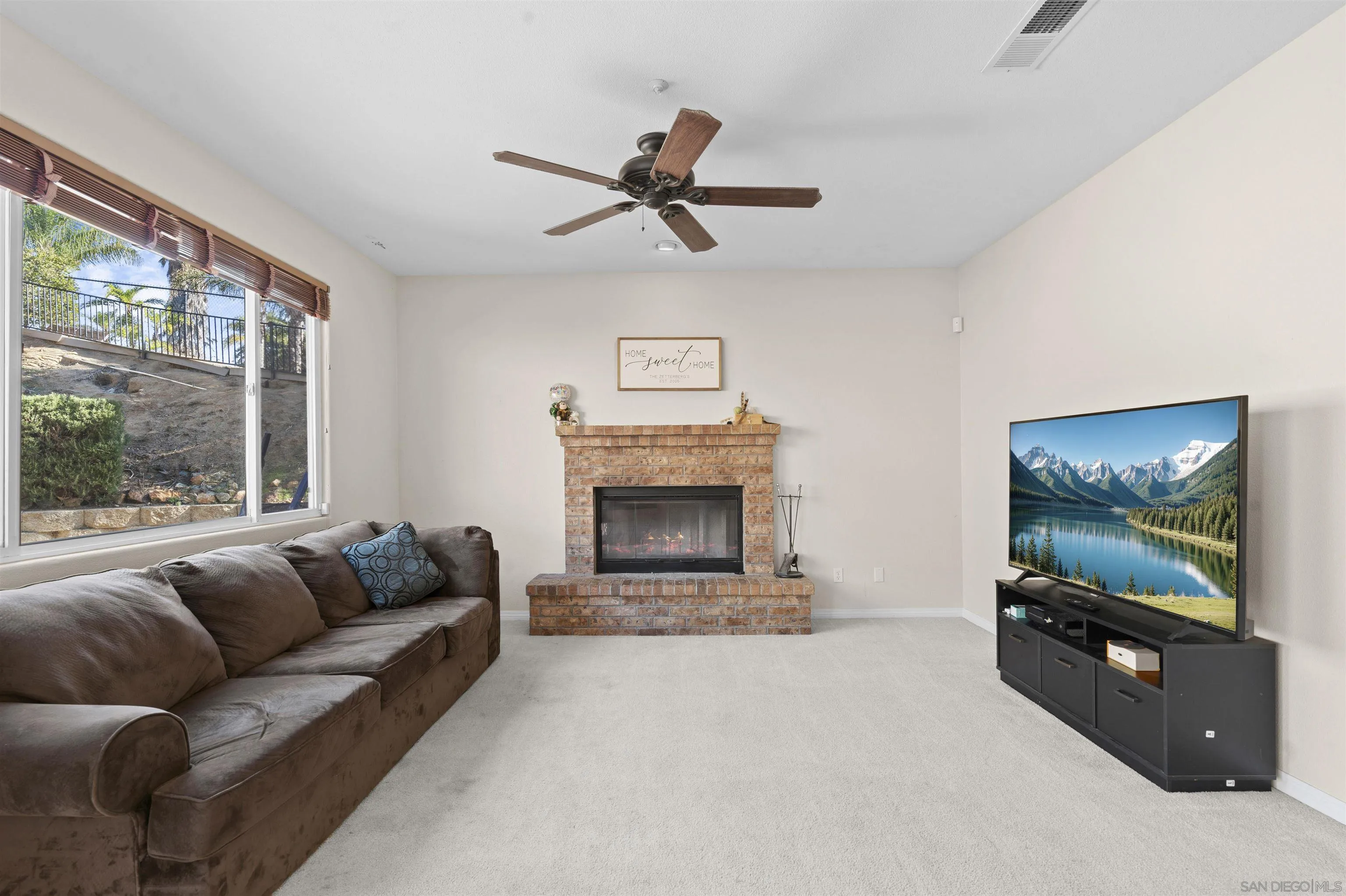 24534 Rutherford Road Ramona, CA 92065 - Photo 10 of 19 a living room with furniture and a flat screen tv