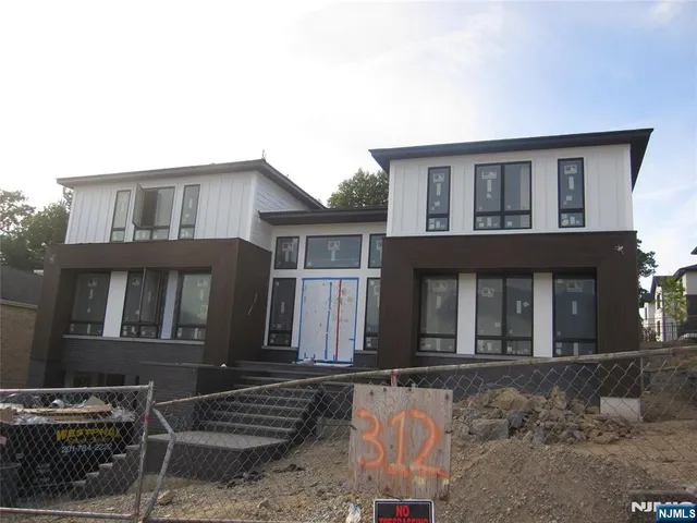 a front view of a house with yard