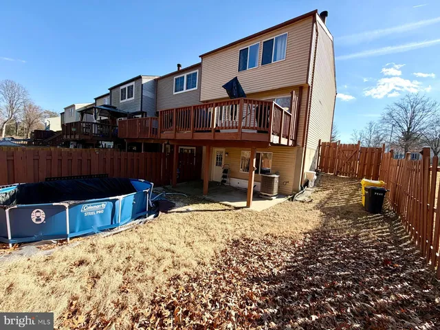 a view of a house with a yard covered in snow