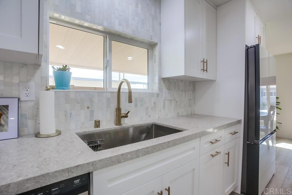 8301 Mission Gorge Road Santee, CA 92071 - Photo 11 of 35 a kitchen with a sink and cabinets