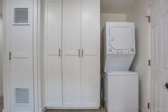 a close view of a utility room with dryer and washer