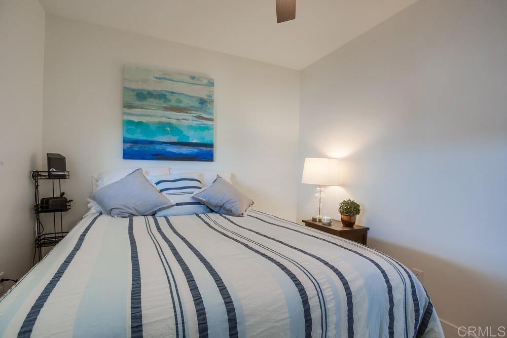 8301 Mission Gorge Road Santee, CA 92071 - Photo 21 of 35 a bedroom with a bed and painting on the wall