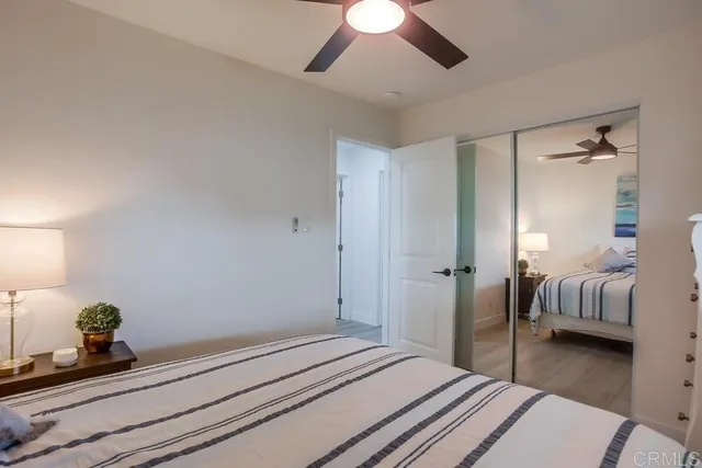 a bedroom with a bed and lamp