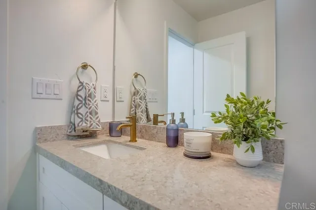 a dining room with furniture and potted plant