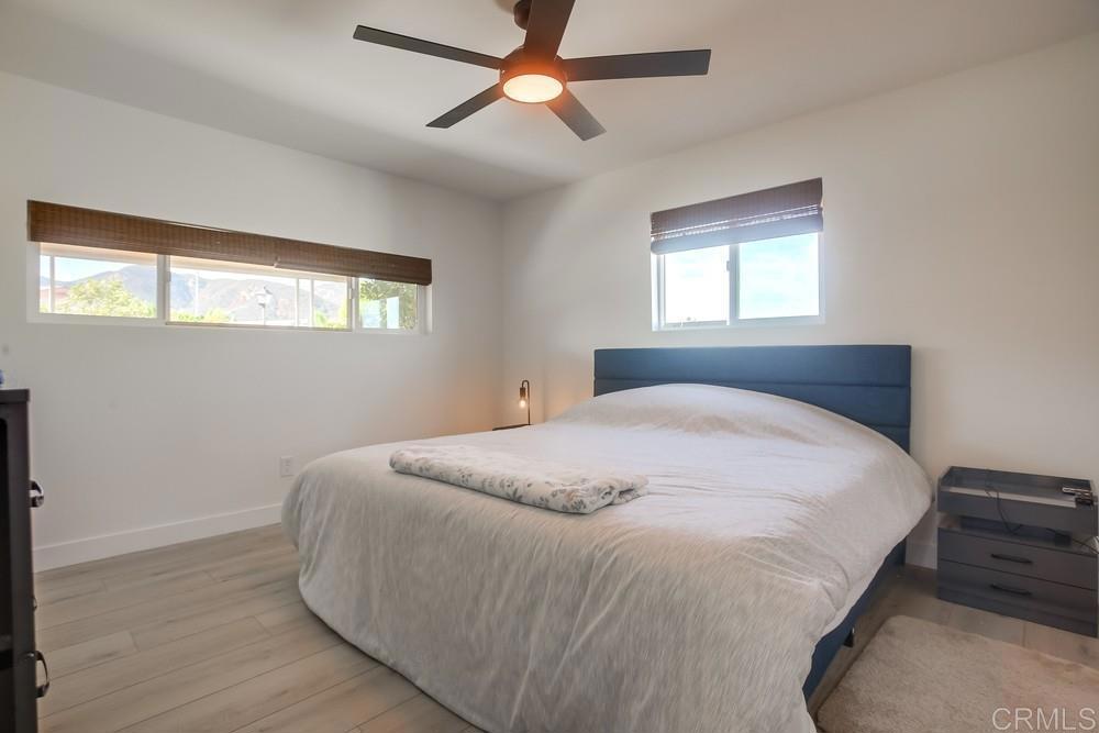 8301 Mission Gorge Road Santee, CA 92071 - Photo 26 of 35 a large bed in a bedroom next to a window