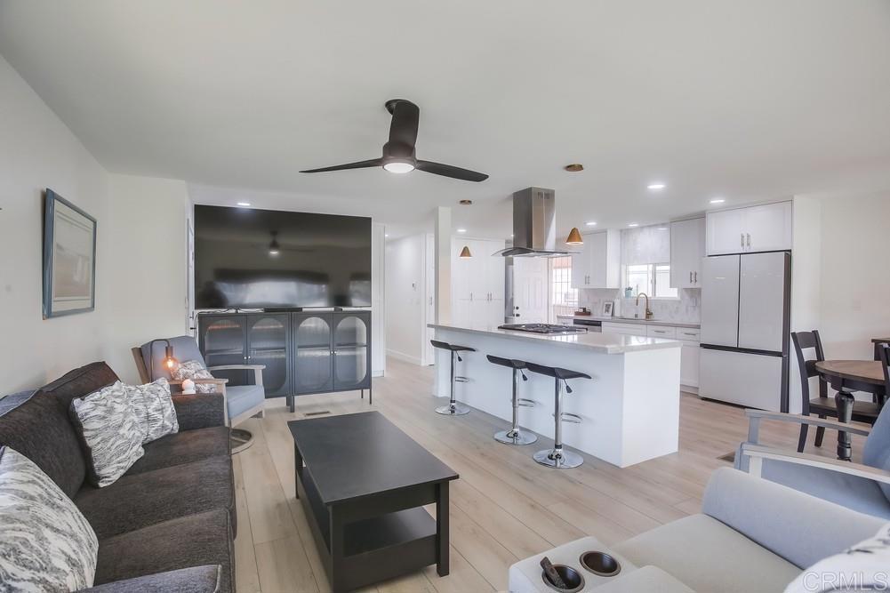 8301 Mission Gorge Road Santee, CA 92071 - Photo 5 of 35 a living room with furniture and a flat screen tv