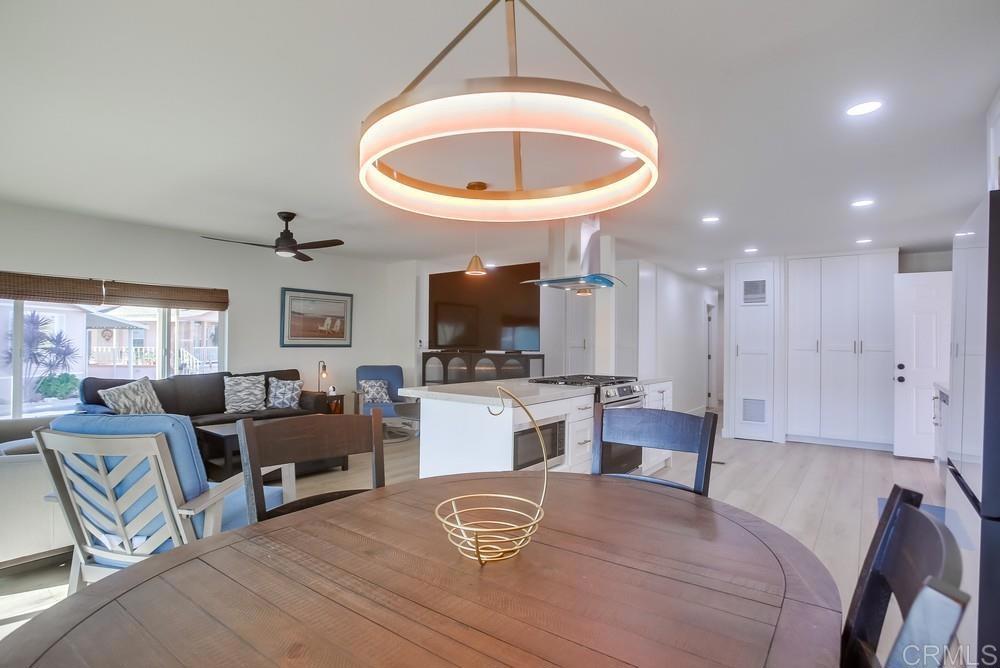 8301 Mission Gorge Road Santee, CA 92071 - Photo 8 of 35 a living room with furniture a flat screen tv and a large window